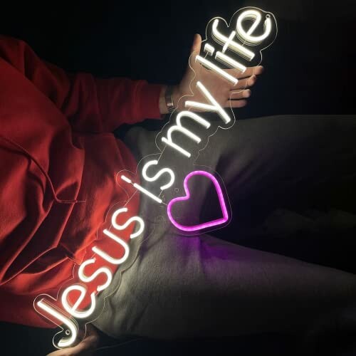 Neon sign reading 'Jesus is my life' with a heart symbol