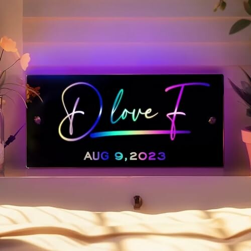 Neon sign with 'D love F' and date Aug 9, 2023